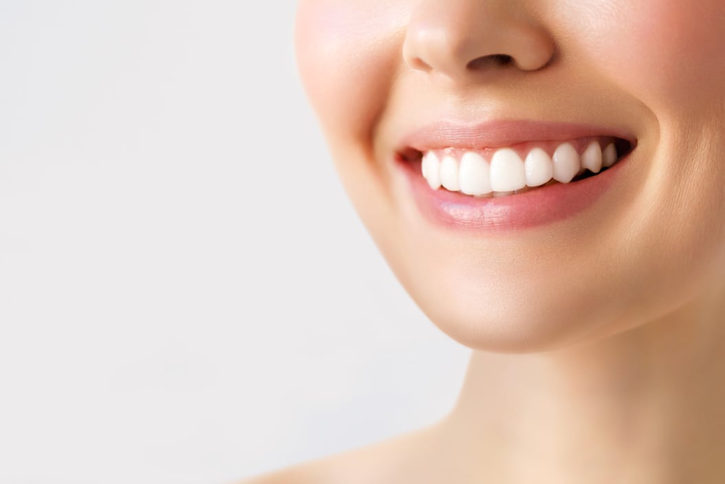 Perfect healthy teeth smile of a young woman. Teeth whitening. Image symbolizes oral care dentistry